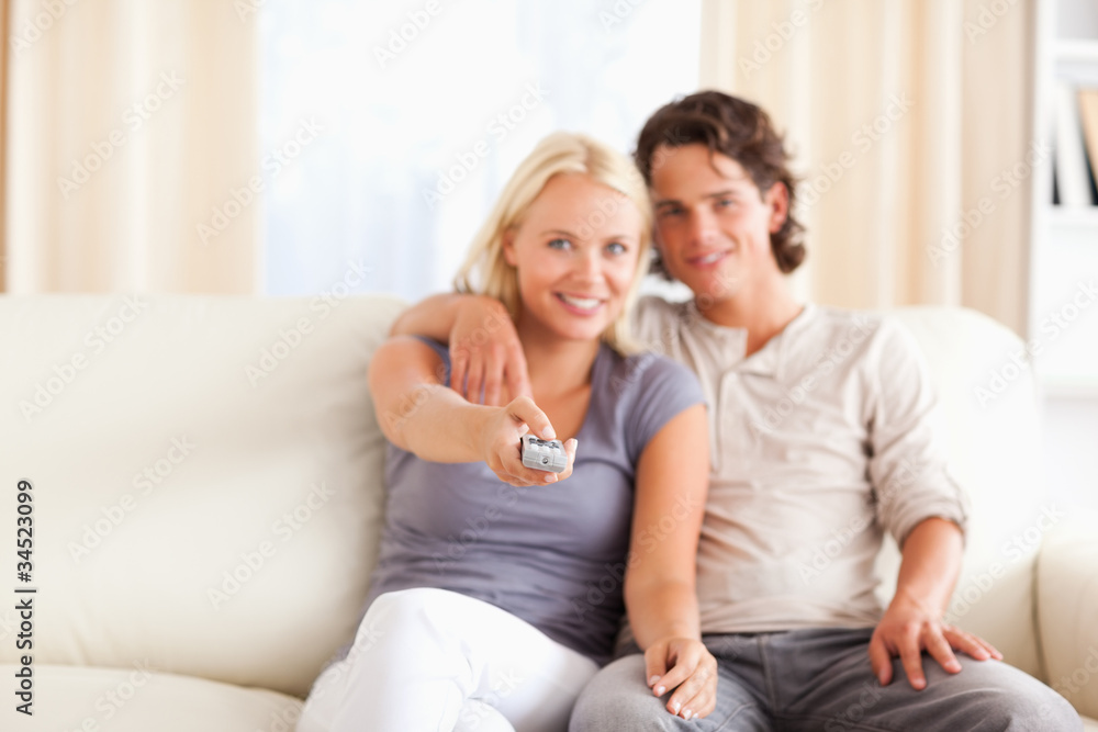 Lovely couple watching TV