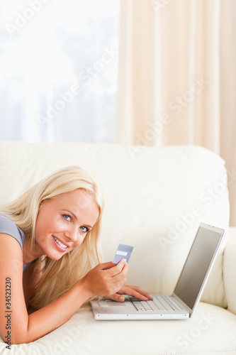 Portrait of a smiling woman purchasing online