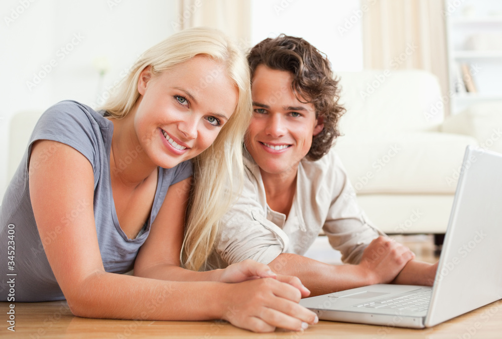 Close up of a couple with a laptop Close up of a couple with a laptop
