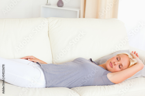 Calm woman lying on a couch