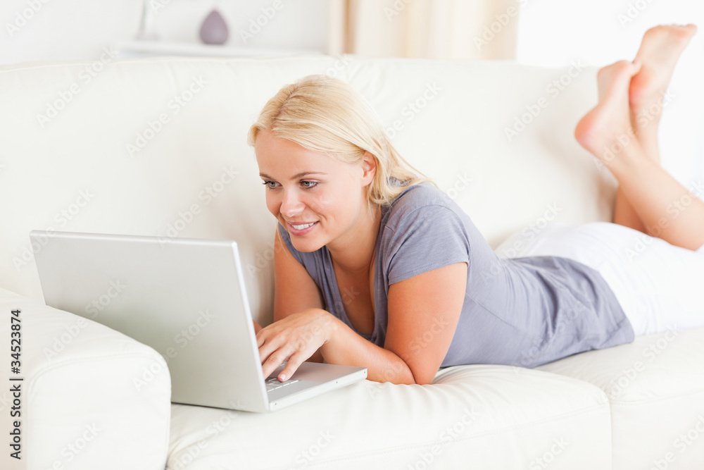 Blonde woman using a notebook Blonde woman using a notebook
