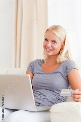 Portrait of a blonde woman shopping online