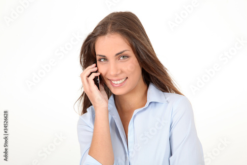 Portrait of beautiful young woman talking on mobilephone