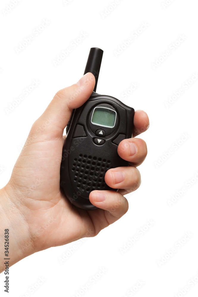 Hand holding walkie-talkie radio Hand holding walkie-talkie radio