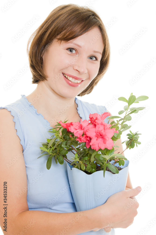 Girl smelling a flower on a white background. Girl smelling a flower on a white background.