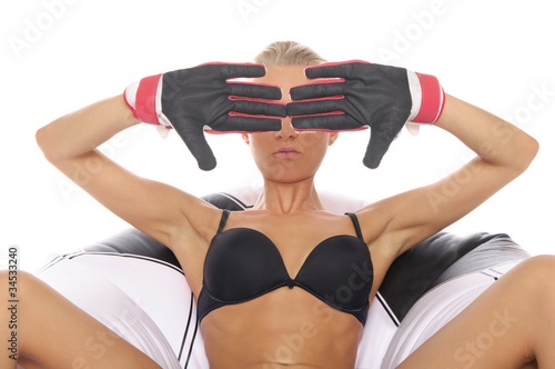 Woman with gloves in chair of soccer ball