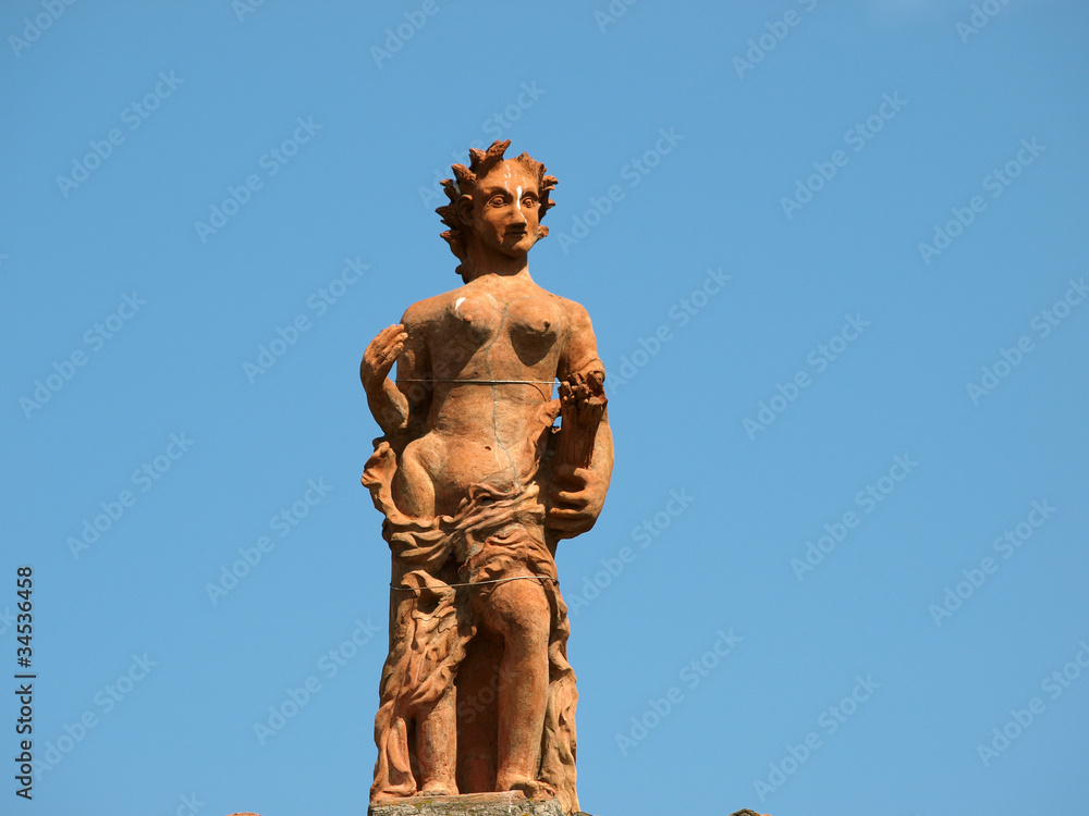 Florence - a sculpture on the roof of the museum of porcelain