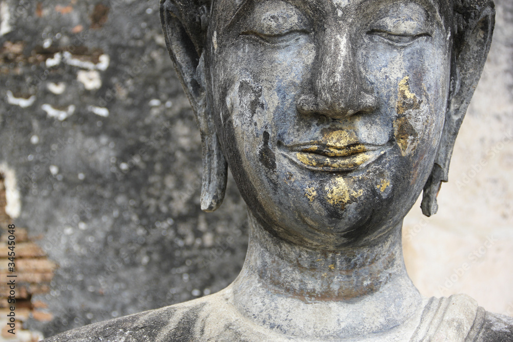 buddhas face temple ruins sukhothai