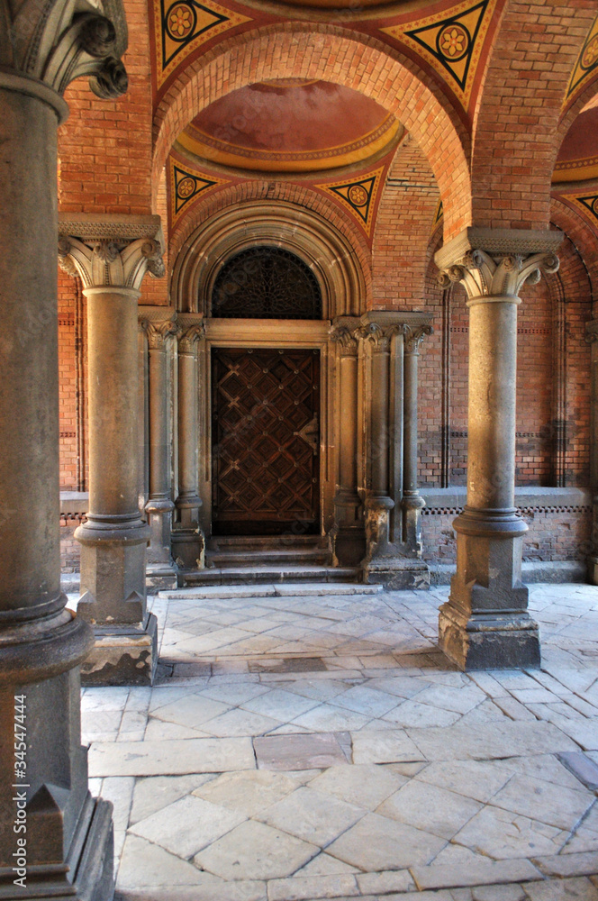 Old door among ancient columns