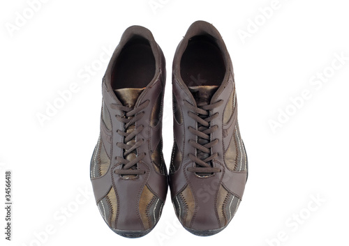 Pair of leather brown sneakers. Isolated
