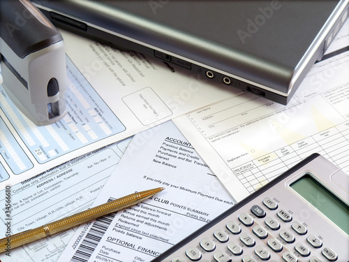 Accounting tools and bills on the table. photo