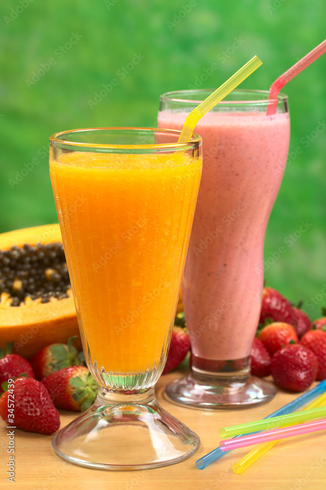 Papaya juice and strawberry milkshake with straws Papaya juice and strawberry milkshake with straws
