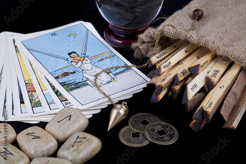 Various fortune telling techniques on a black background