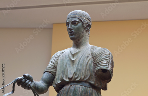 Charioteer statue located at Delphi museum in Greece