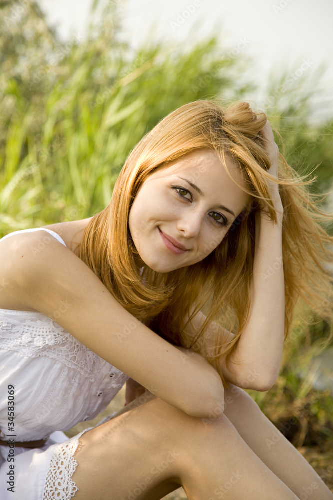 Redhead girl at outdoor.