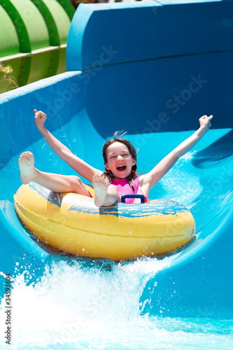 Girl on water slide photo