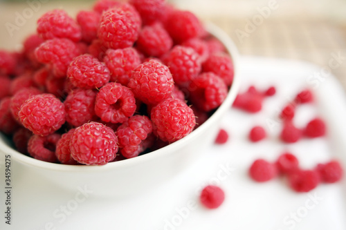 plate full of raspberries