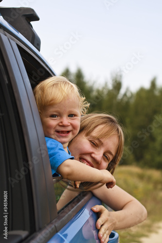 Baby with mother looking through car window © nadezhda1906