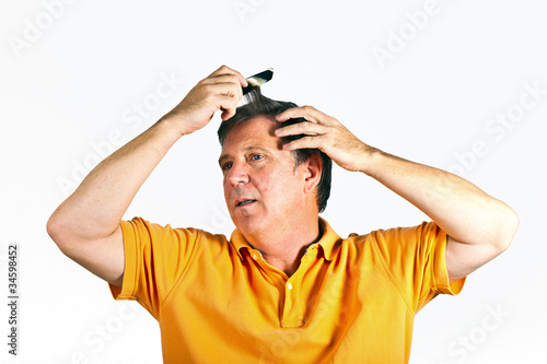attractive man combing his hair