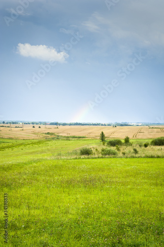 Countryside landscape with rainbow