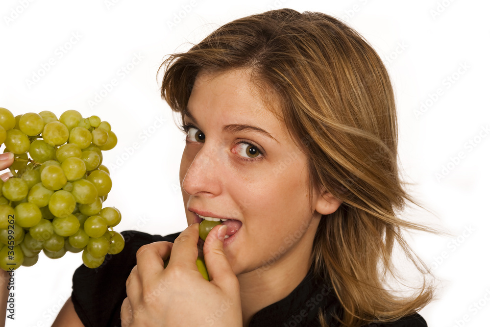 young woman holding green fruit over white background young woman holding green fruit over white background