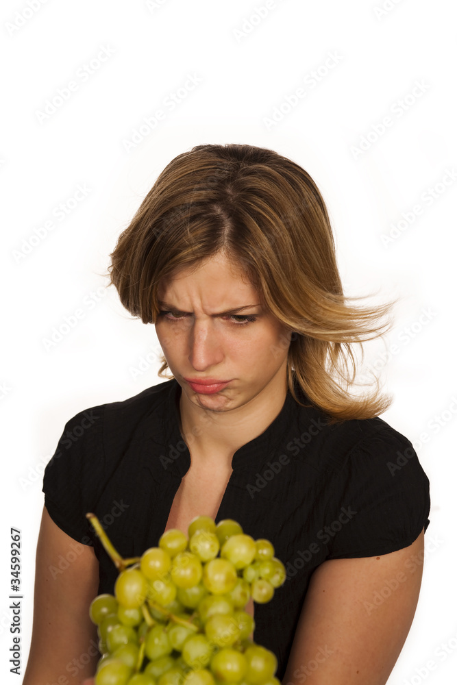 young woman holding green fruit over white background young woman holding green fruit over white background