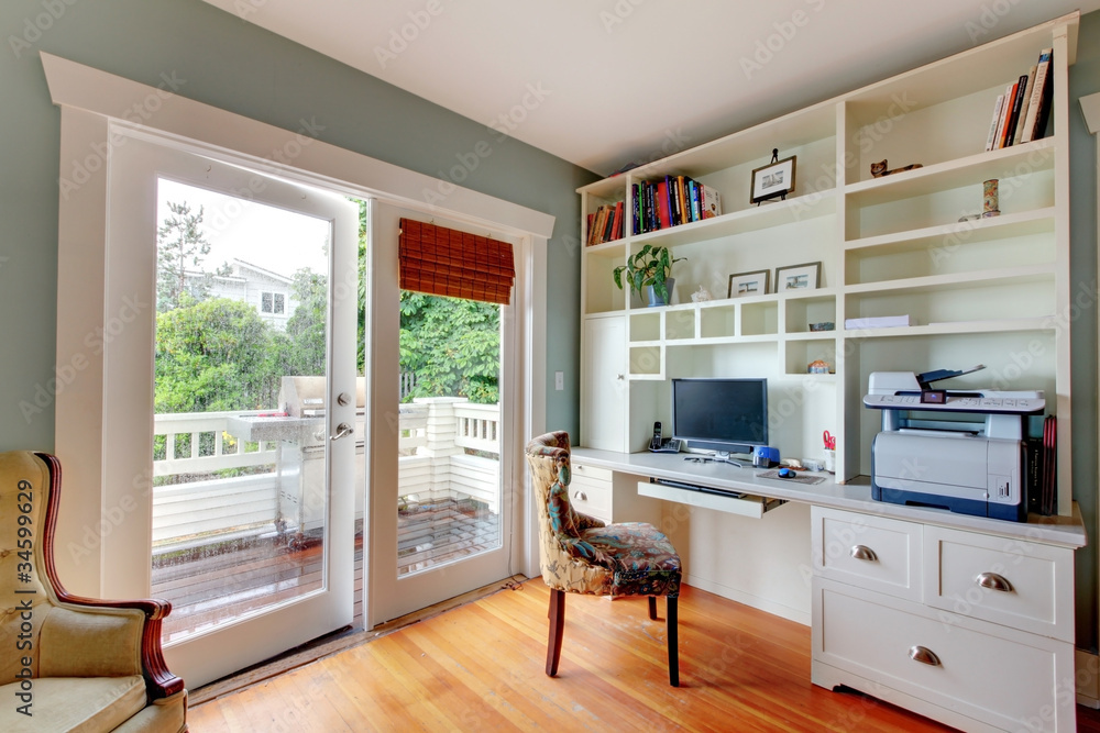 Home office with green walls and white shelves Stock Photo Adobe Stock
