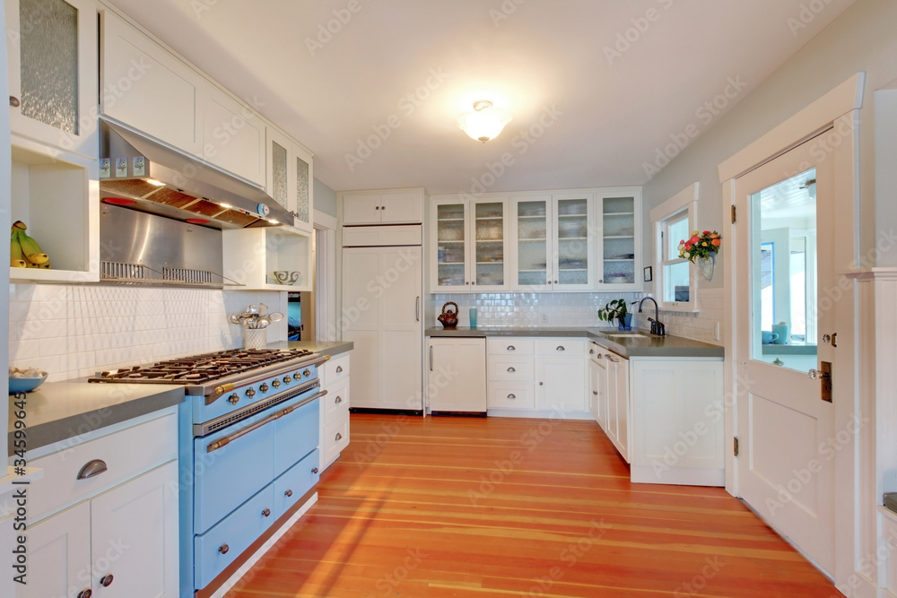 Beach cottage white kitchen with blue stove