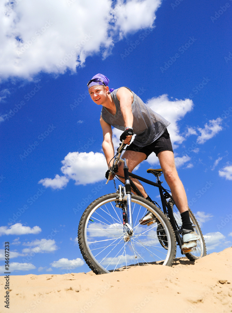 Young men  riding a bike
