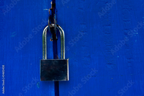 padlock on blue door photo