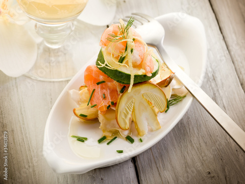 salad with shrimp salmone carpaccio and slice ovum mushroom photo