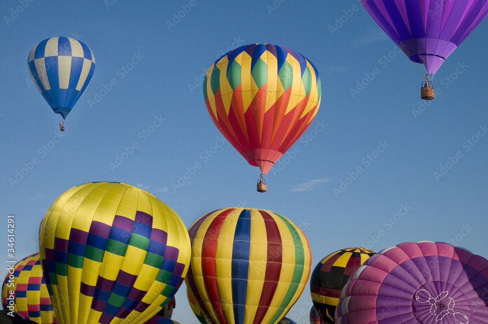 Fototapeta premium Hot-air balloon ascending over others