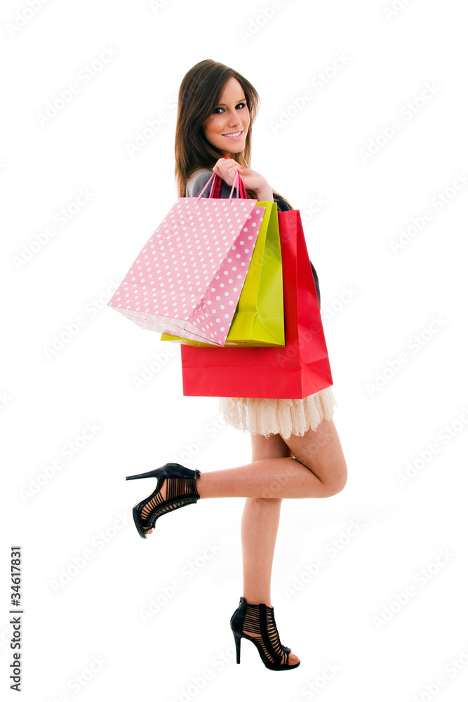 Lovely young woman with shopping bags over white background Lovely young woman with shopping bags over white background