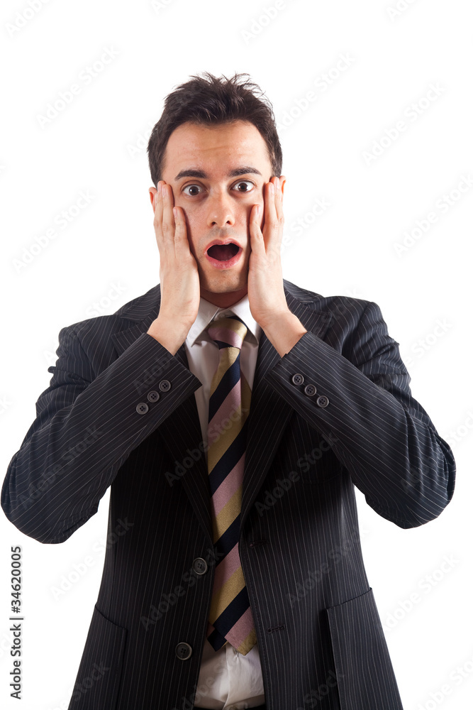 Young man with a shocked facial expression. Isolated on white. Young man with a shocked facial expression. Isolated on white.
