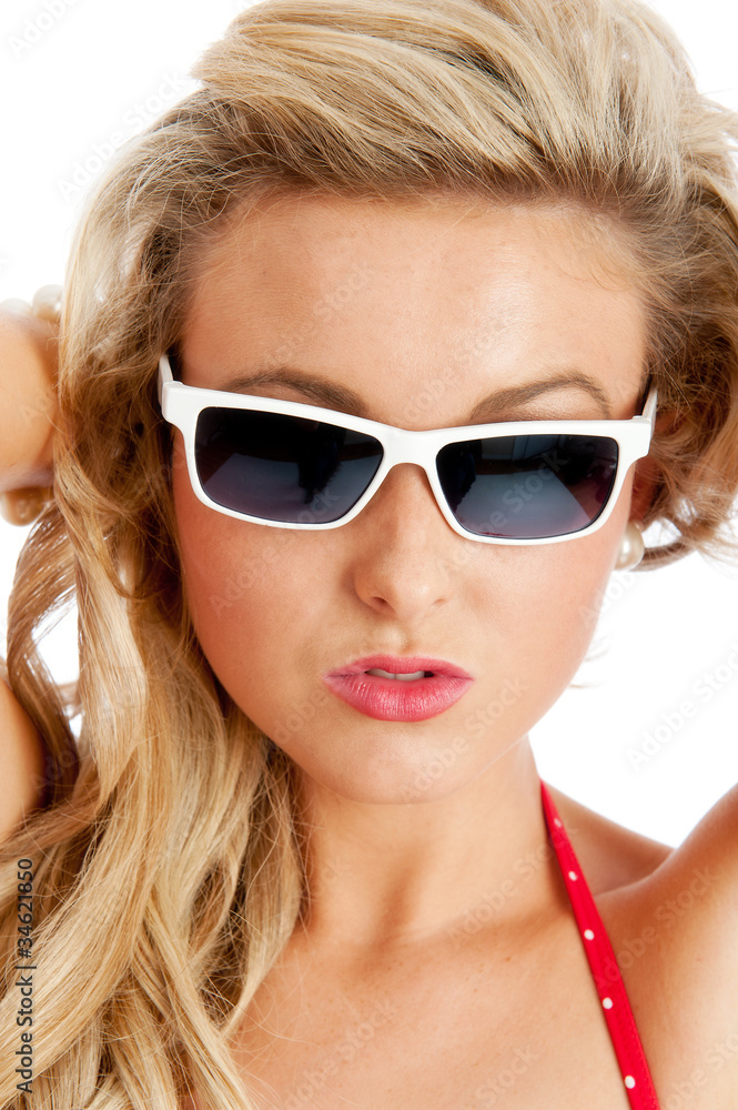 Young female in white sunglasses and swimsuit Young female in white sunglasses and swimsuit