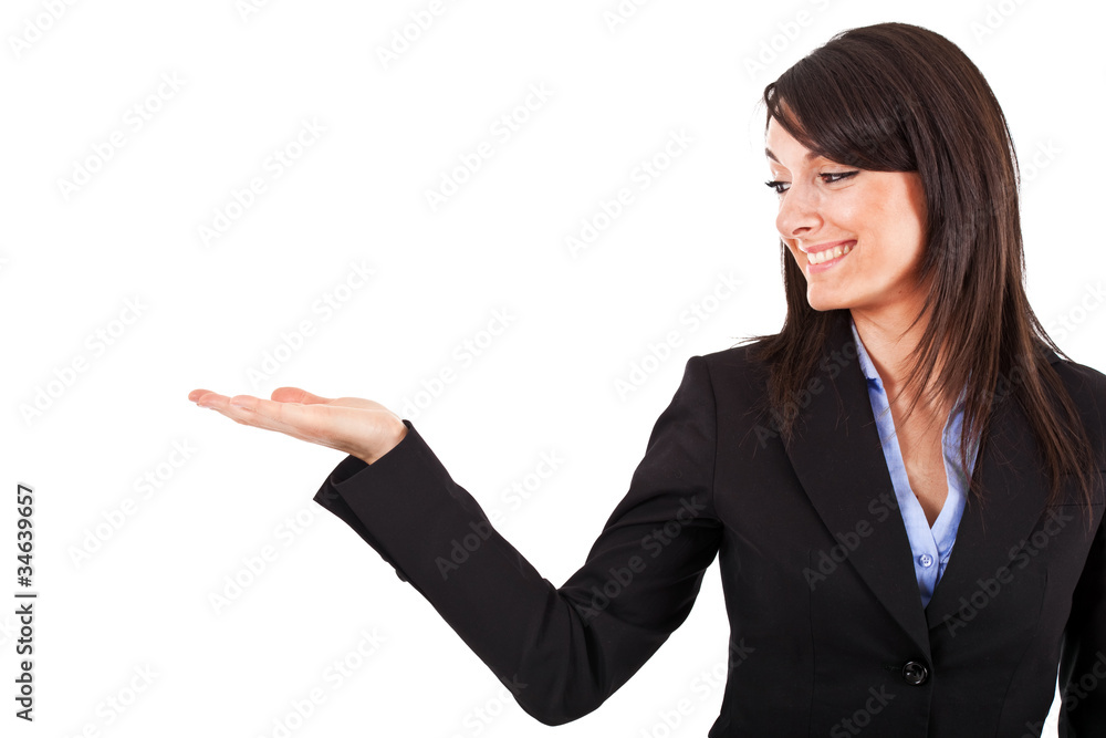 Smiling woman showing copy space for product with open hand palm Smiling woman showing copy space for product with open hand palm