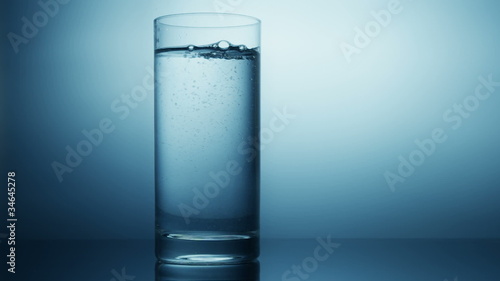 pouring water in glass