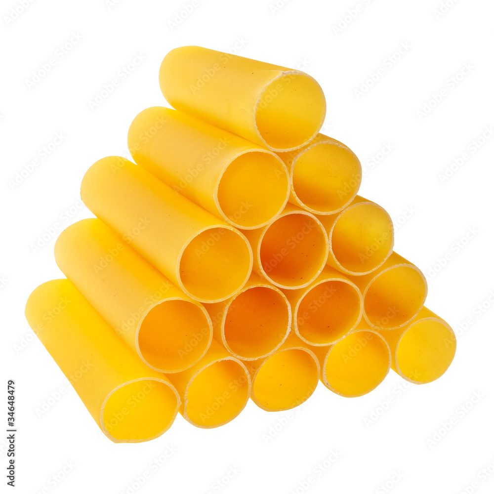 Italian cannelloni pasta tubes stacked over white background. Italian cannelloni pasta tubes stacked over white background.