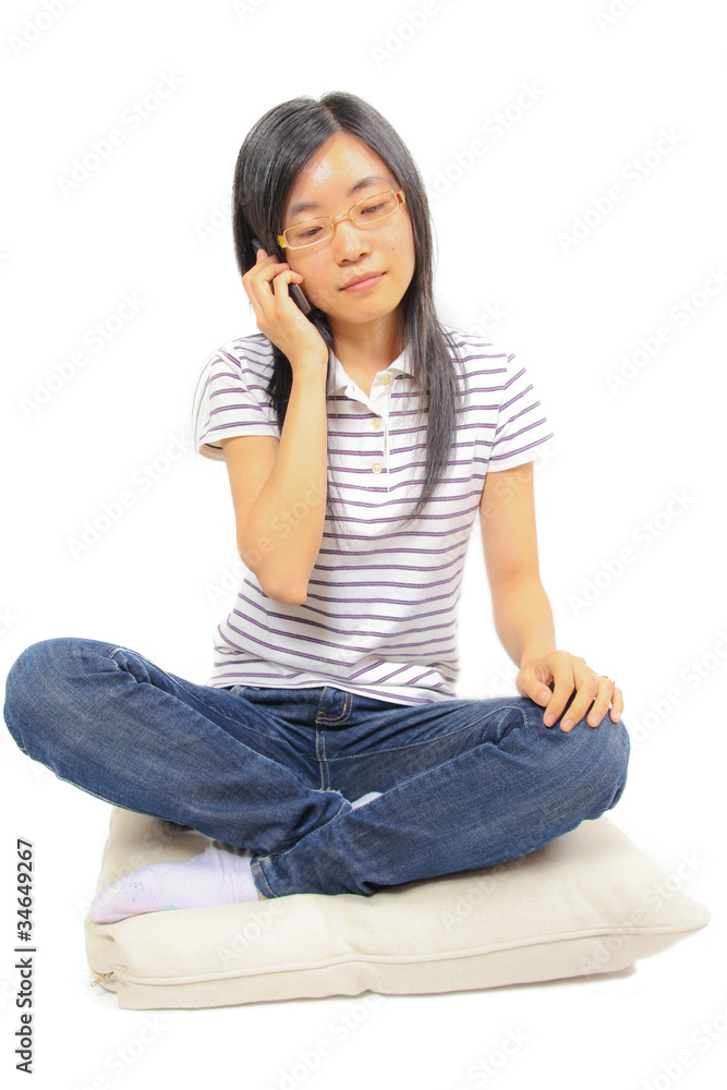 Young chinese woman talking in mobile phone Young chinese woman talking in mobile phone
