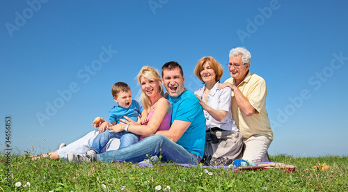 Happy family on picnic in park