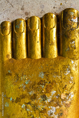 Картината върху платно Foot of Buddha statue with worshipful gold foil