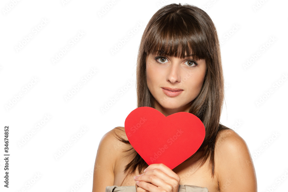 Closeup portrait of young female holding heart shape Closeup portrait of young female holding heart shape