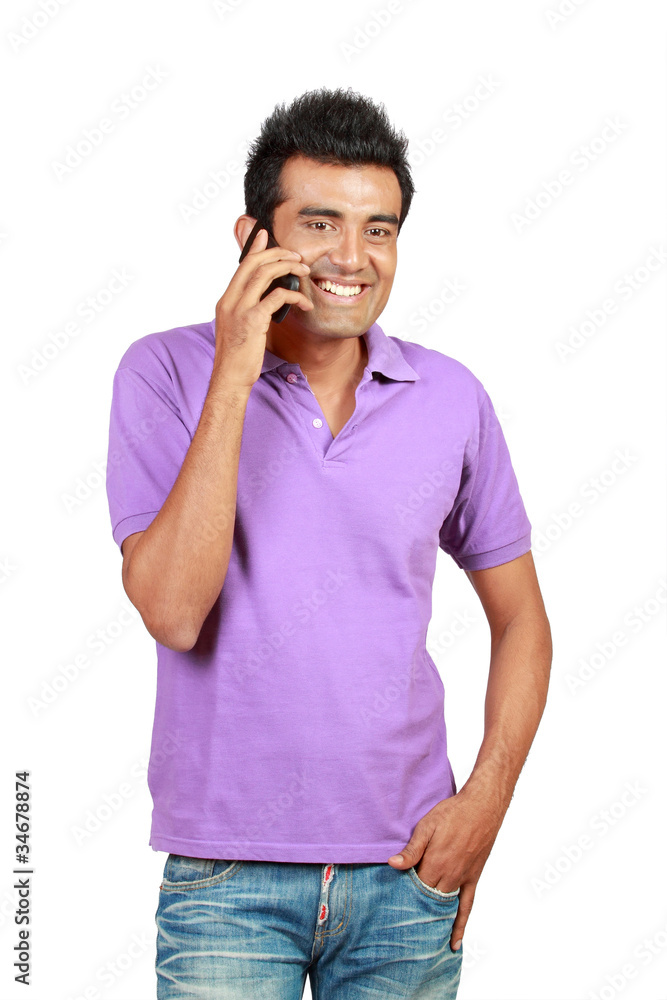 Fototapeta premium Asian man smiling using a mobile phone