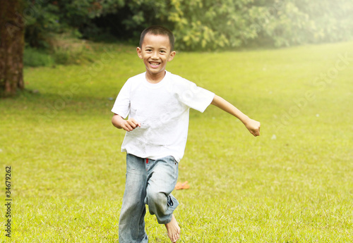 Happy young boy running