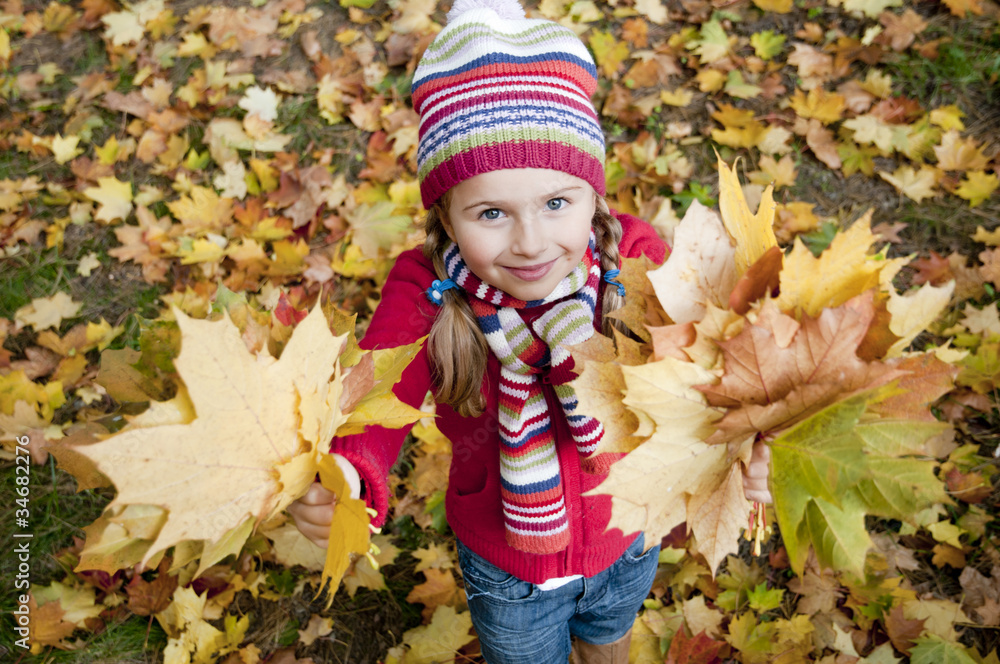 Autumn - little girl playing in autumn park Autumn - little girl playing in autumn park