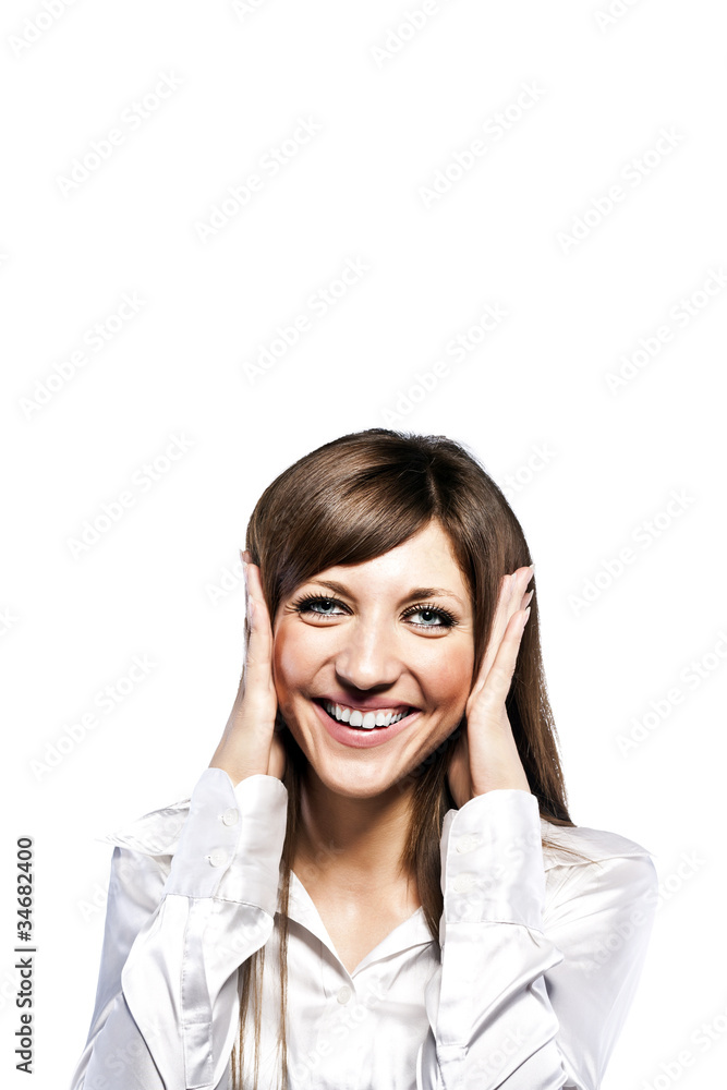 Closeup of surprised girl holding her face and smiling Closeup of surprised girl holding her face and smiling