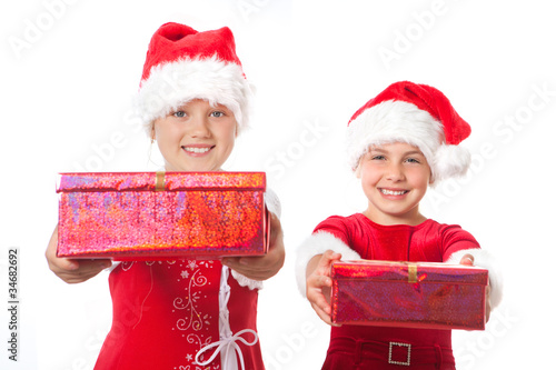 two christmas girls holding gifts photo