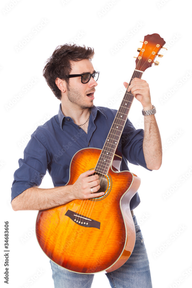 Obraz premium Funny Young Man Playing Guitar