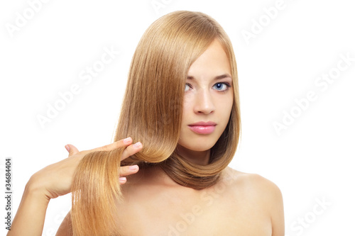 Pretty girl with long hair on white