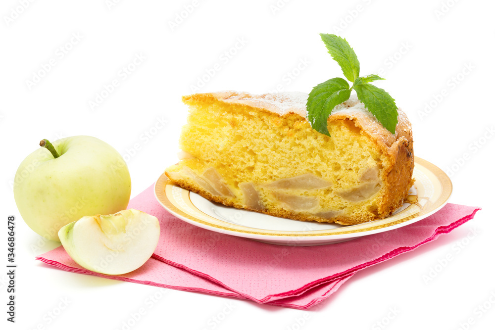 apple sponge cake on the plate with icing sugar and apples